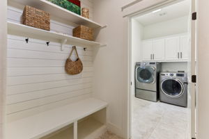 Laundry room located off kitchen and back stairs.