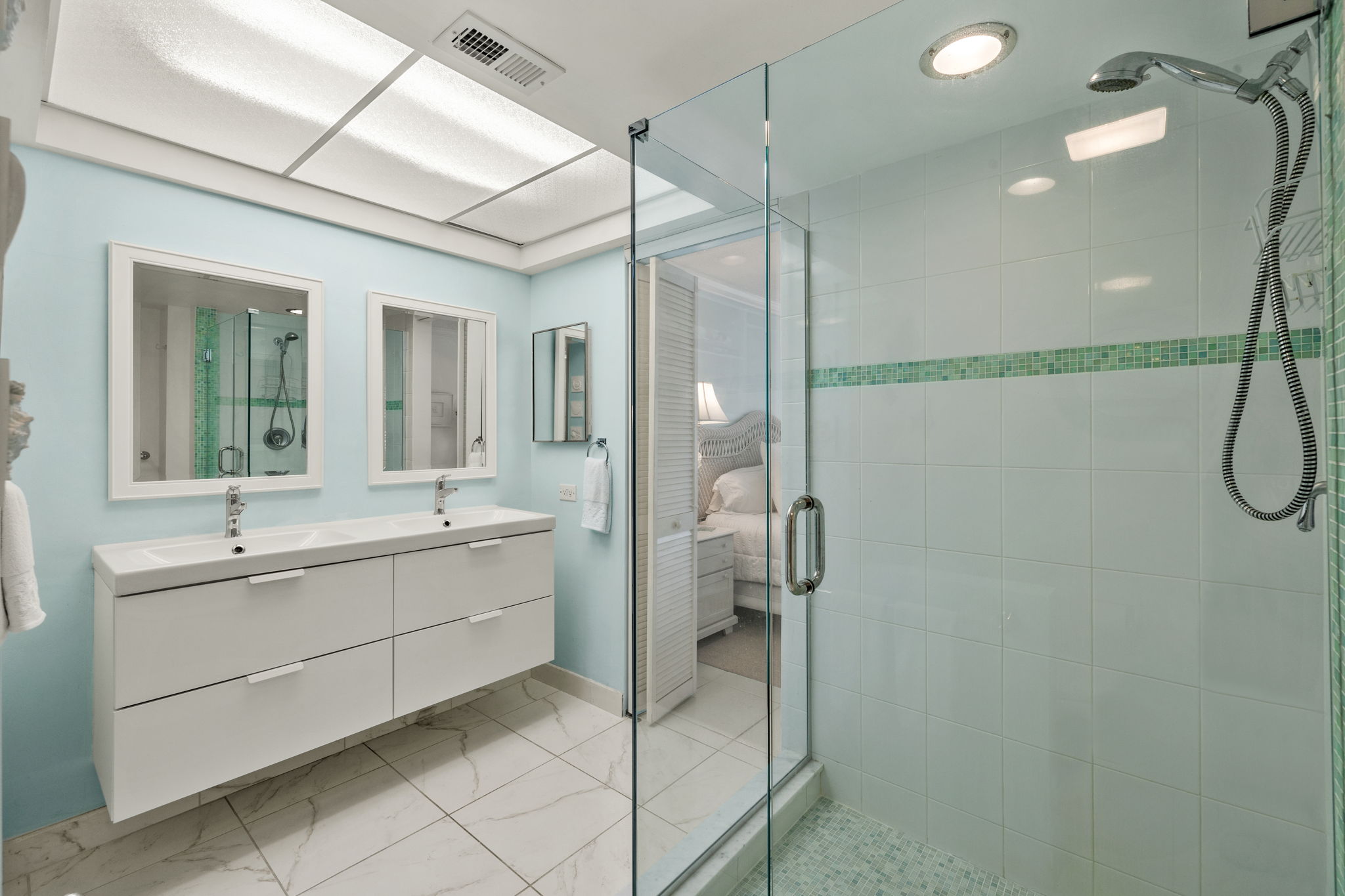 Updated Primary Bathroom, dual vanities, frameless walk-in shower