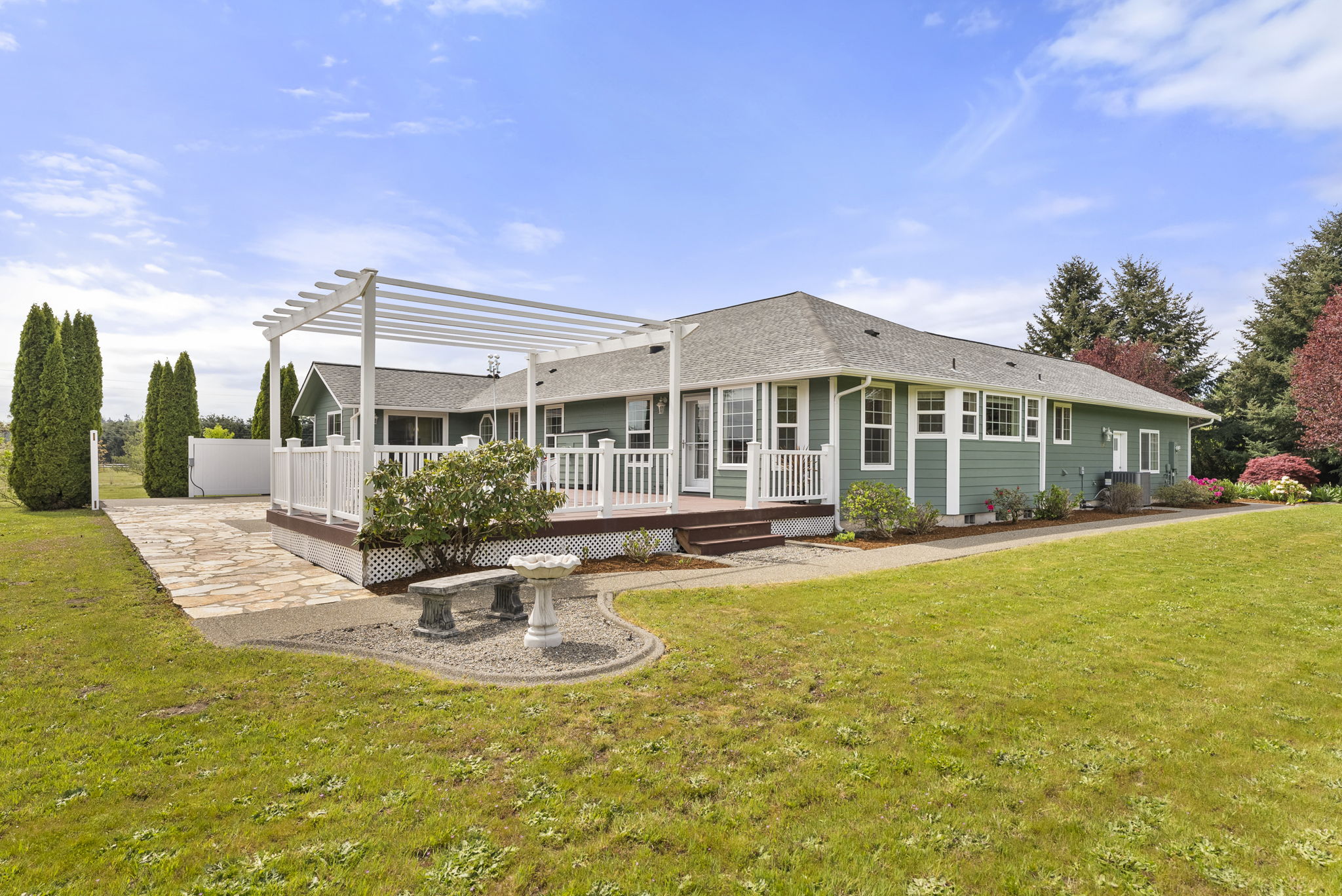 Enjoy the deck under a pergola, hang flower baskets or set up for shade