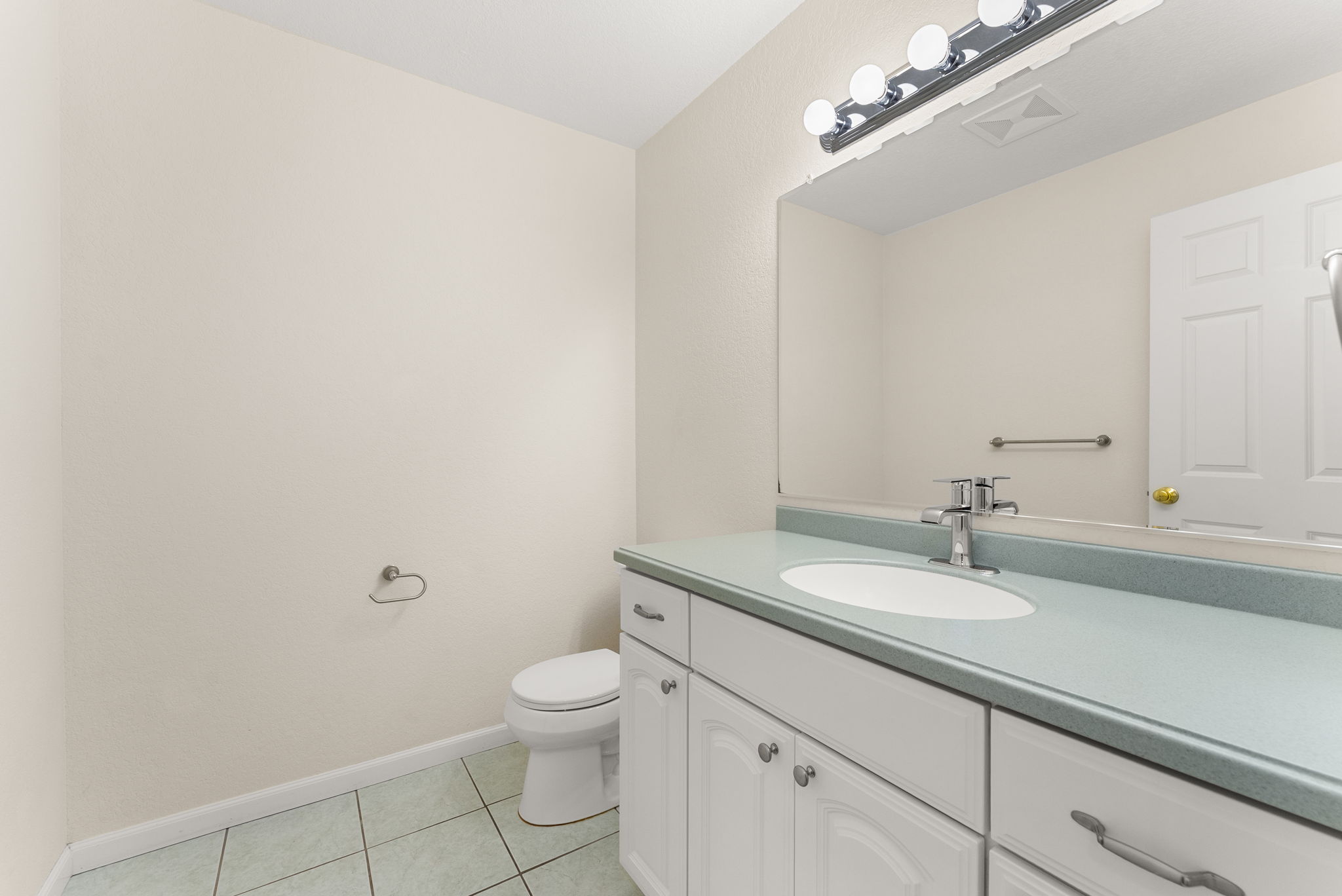 Powder room conveniently located just off the main living area