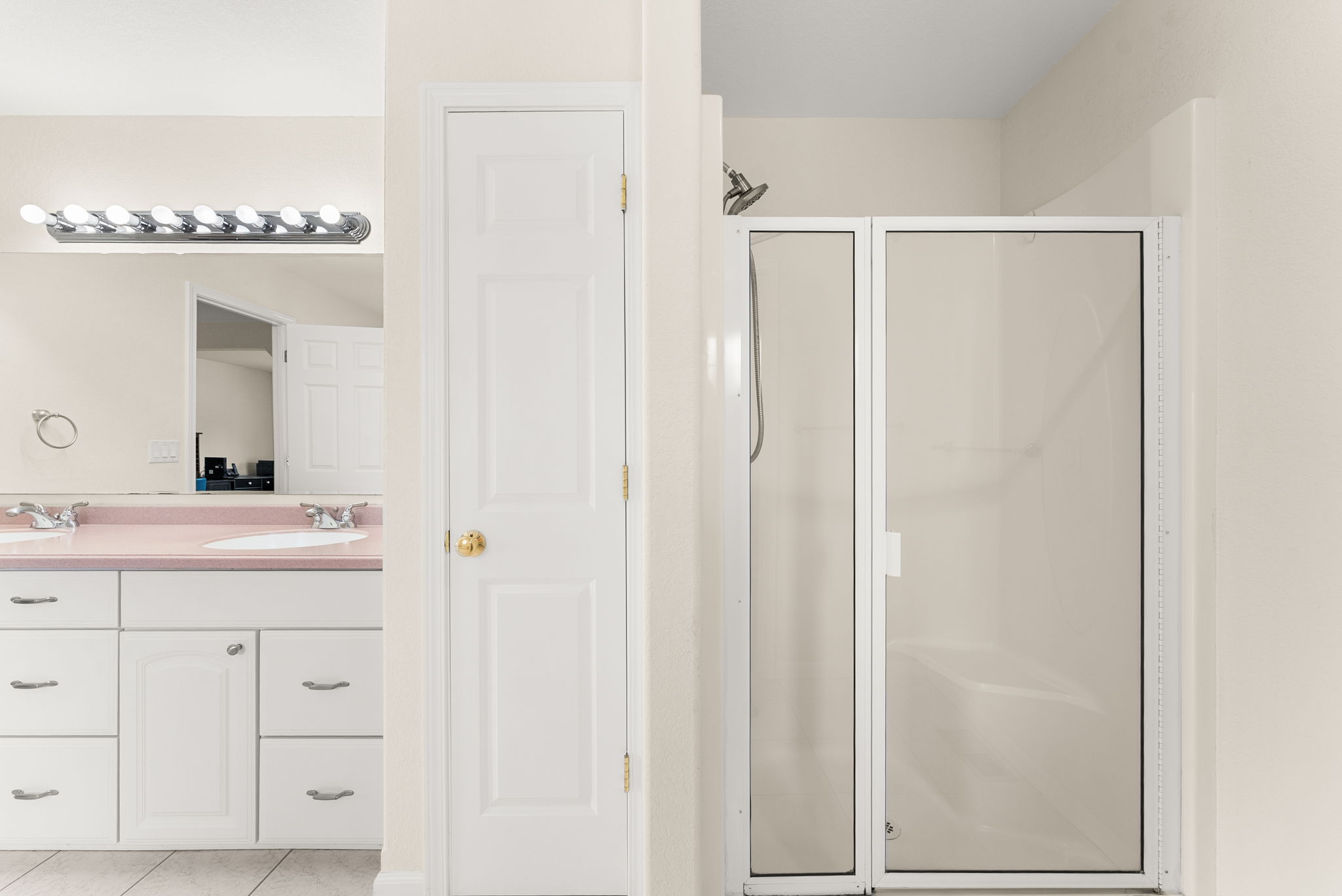 Primary bathroom with built-in storage closet