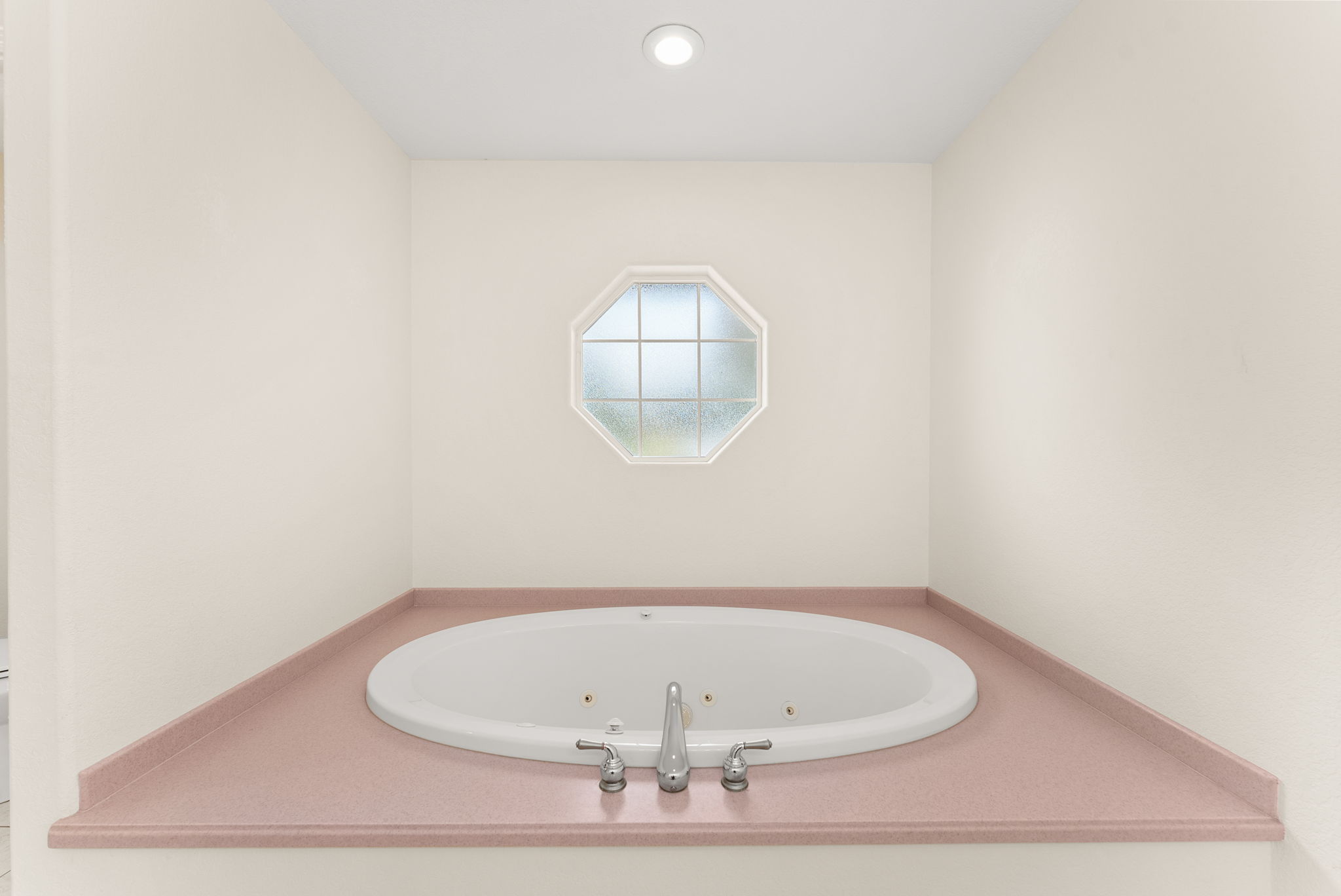 Relaxing jetted soaking tub in the primary bath