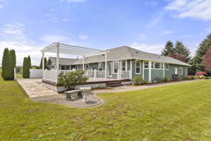 Enjoy the deck under a pergola, hang flower baskets or set up for shade