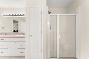 Primary bathroom with built-in storage closet