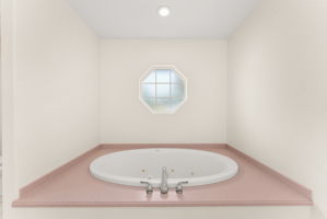 Relaxing jetted soaking tub in the primary bath