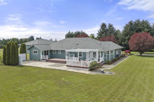 Fresh exterior paint on both the home and shop,