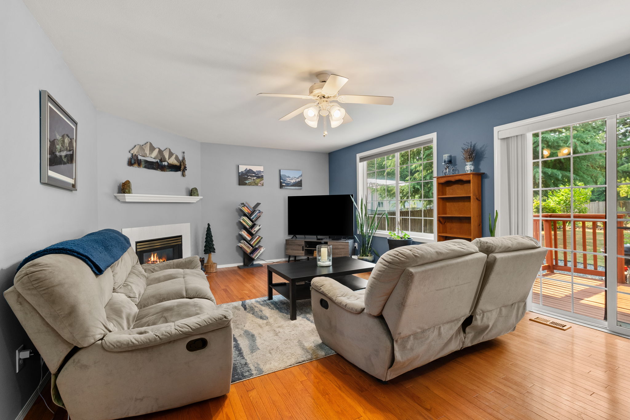 Natural light, hardwood floors, and a cozy gas fireplace make this the perfect place to gather year-round.