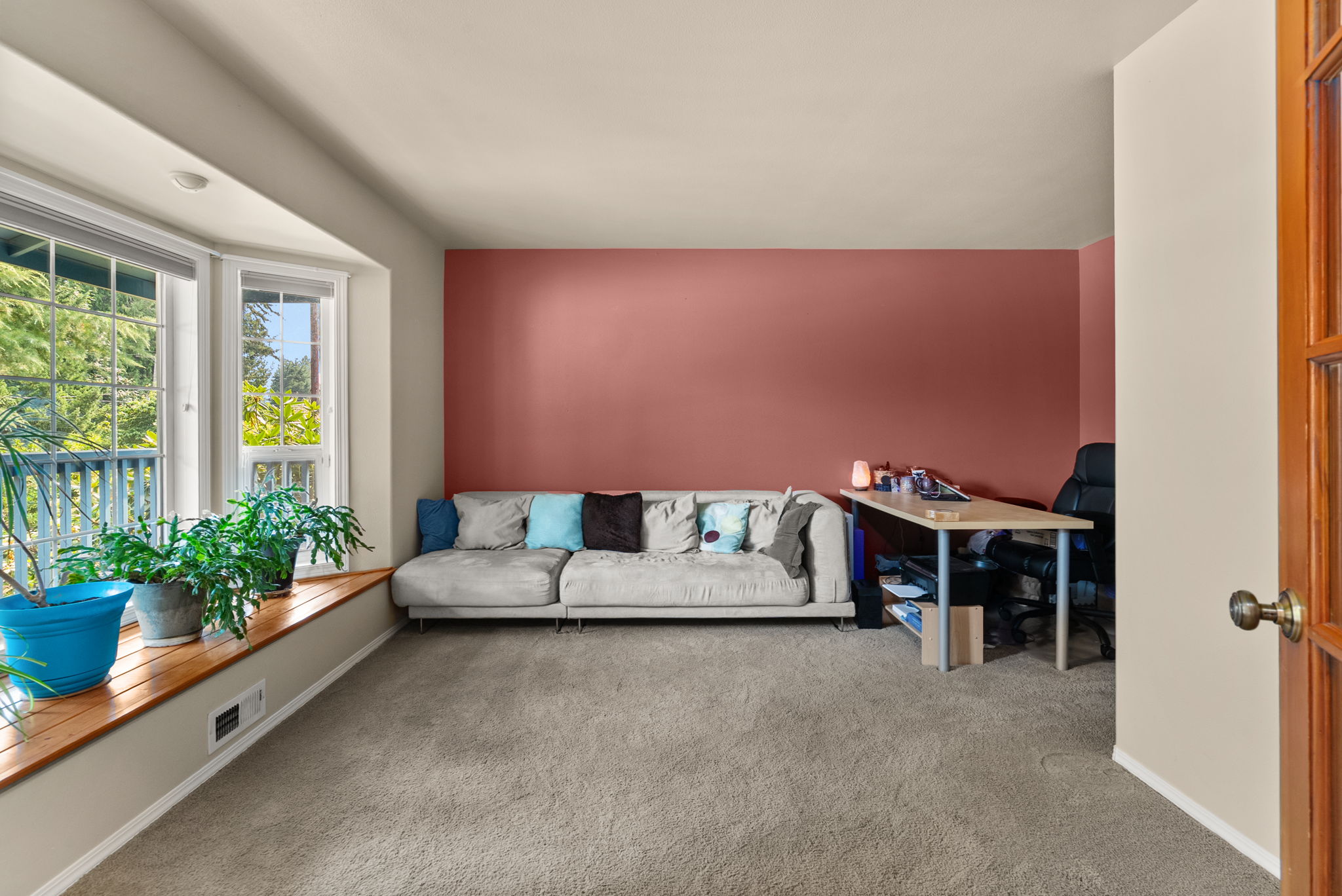 Versatile main-level office or bonus room featuring a large bay window—ideal for working from home, a playroom, media room, or guest retreat.