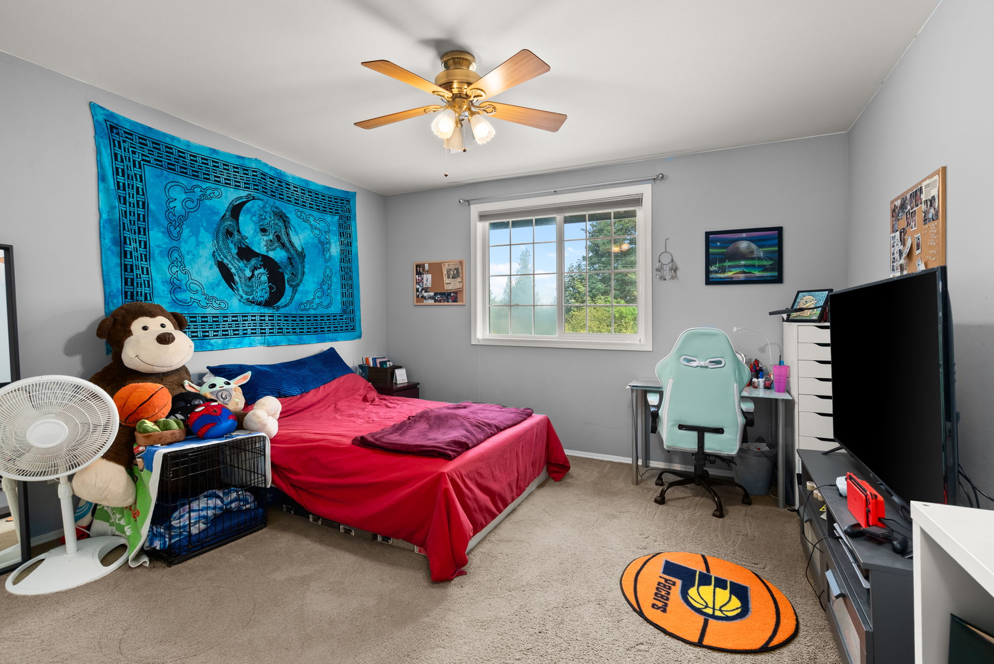 Large secondary bedroom with generous natural light and flexible space for guests, hobbies, or growing households.