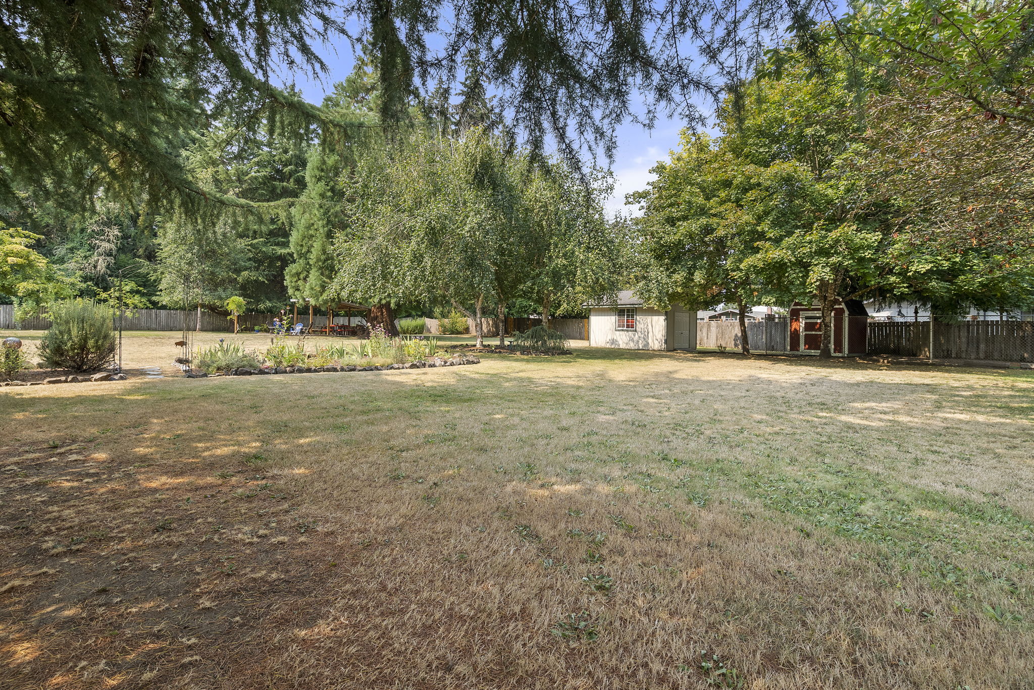 Large level backyard with room for games, gardening, pets, and making lasting memories.
