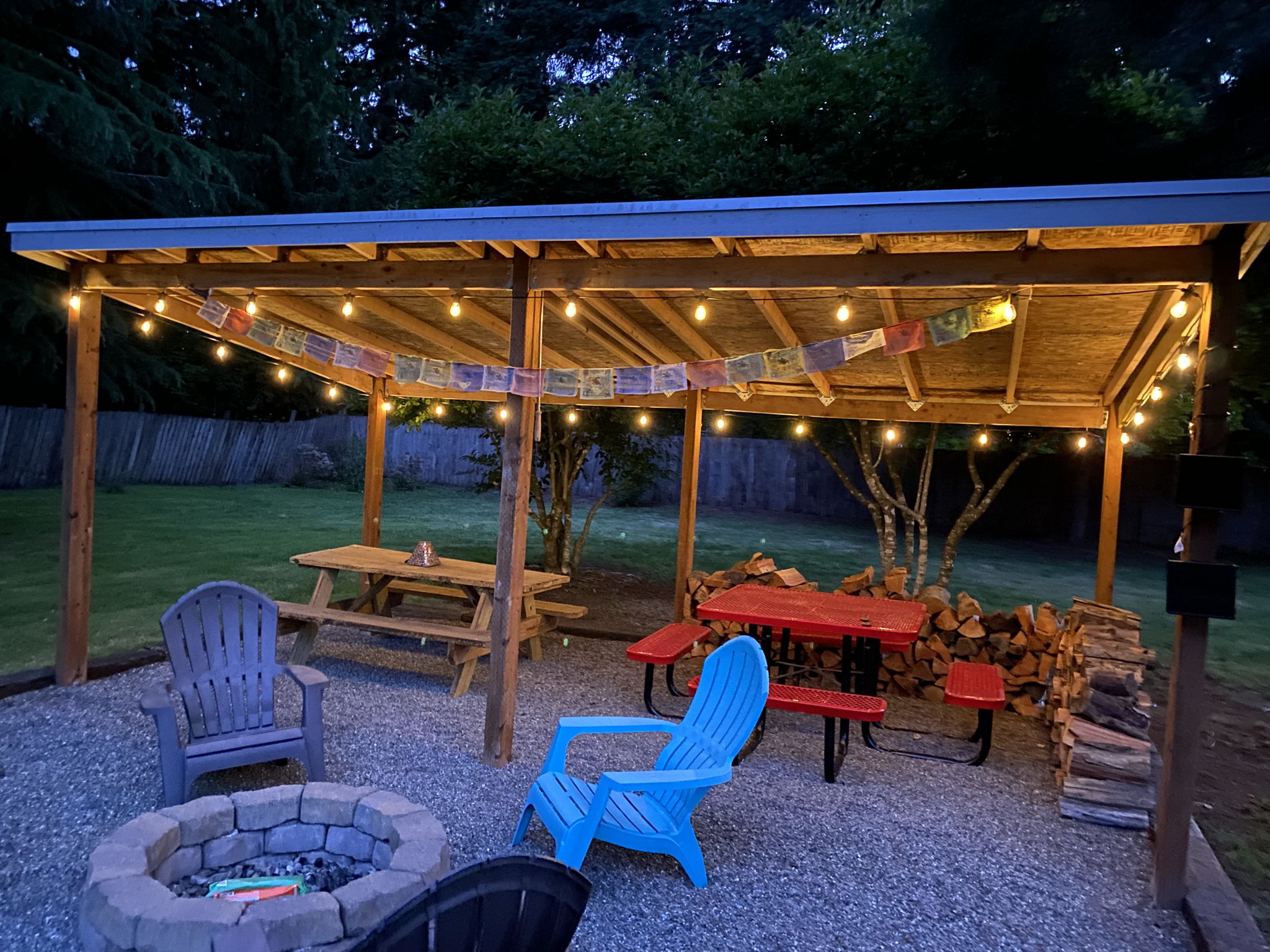 Gather year-round under the covered pavilion featuring a built-in fire pit, picnic area, and plenty of space for entertaining family and friends.