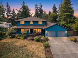 Beautiful curb appeal with fresh exterior paint, lush landscaping, and a welcoming covered front porch, all tucked away on a quiet dead-end road.