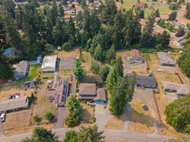 Nearly .79 acres of privacy with mature landscaping, peekaboo Pattison Lake views, and plenty of room to spread out.