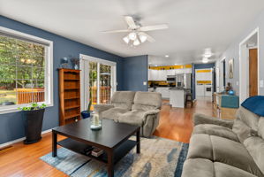 A seamless layout connects the living room, kitchen, and outdoor deck—ideal for everyday living and entertaining.