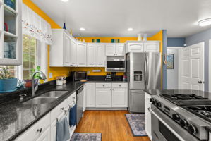 Prepare meals with ease using the gas range, expansive countertops, and generous prep space.