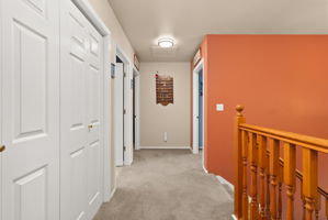 Spacious upstairs landing provides easy access to all bedrooms while enhancing the home's open layout.
