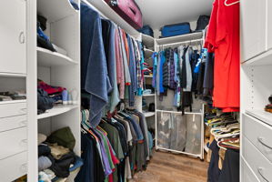Custom walk-in closet with built-in organization designed to maximize storage and simplify everyday living.