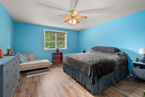 Generously sized primary suite offering peaceful front and backyard views and plenty of room for a king-size bedroom set.