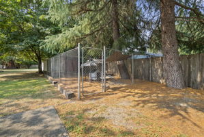 Dedicated fenced dog run provides a secure space for pets to play and exercise.