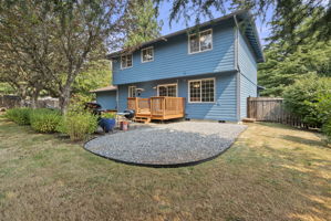 Fresh exterior paint and a spacious backyard combine beauty with low-maintenance outdoor living.