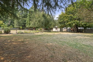 Large level backyard with room for games, gardening, pets, and making lasting memories.