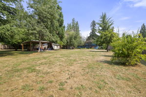 Expansive, fully fenced backyard offers room to garden, play, entertain, or simply enjoy the peaceful surroundings.