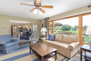 Family room with Pella windows overlooks private pond