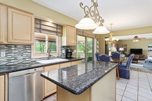 Stainless appliances and custom backsplash