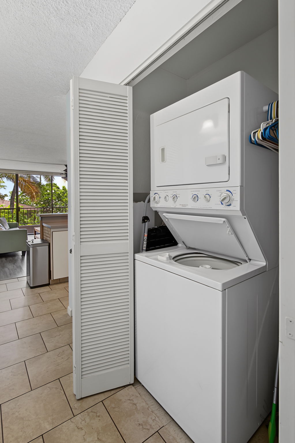 Stack washer and dryer in the hallway.