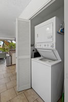 Stack washer and dryer in the hallway.