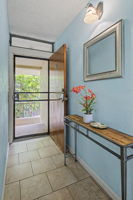 Entry is welcoming. Note security screen door.