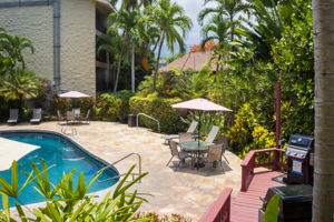 BBQ deck next to pool.