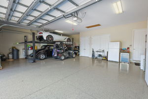 ENORMOUS 998sf 3-car + golf cart garage with CAR LIFT!