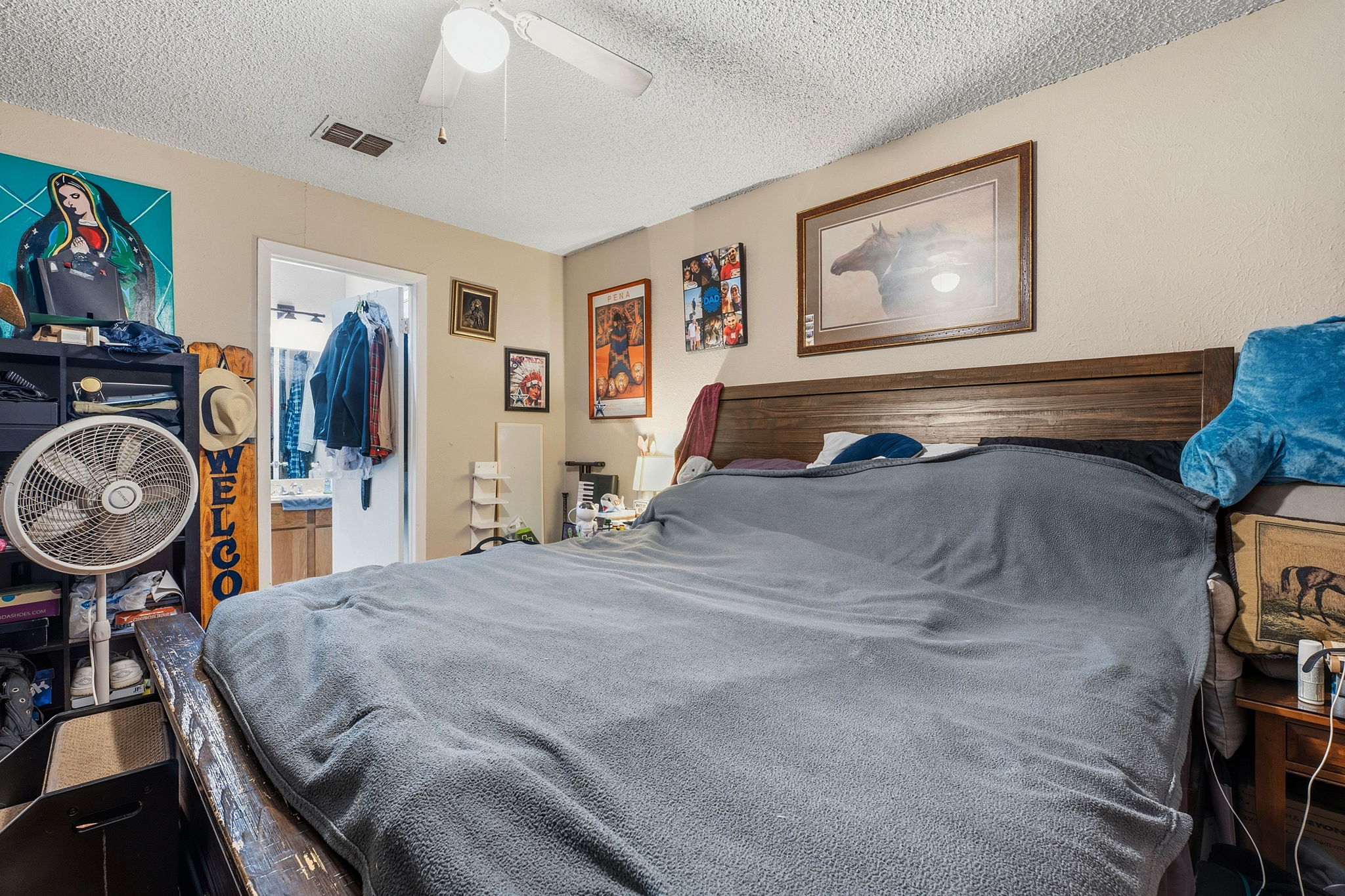 Unit A. Primary bedroom. (with view to en suite bathroom which has walk-in closet.