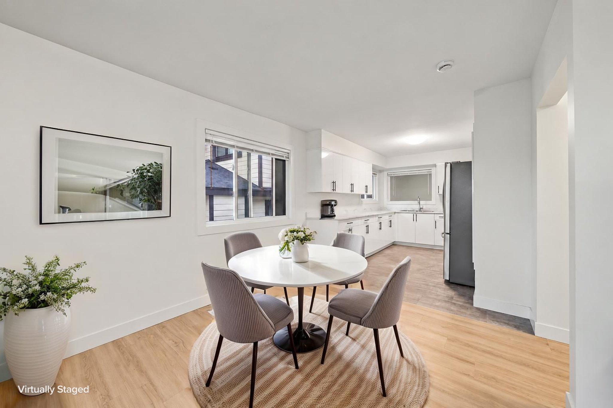 Decluttered open-plan kitchen and living area virtually staged.jpeg