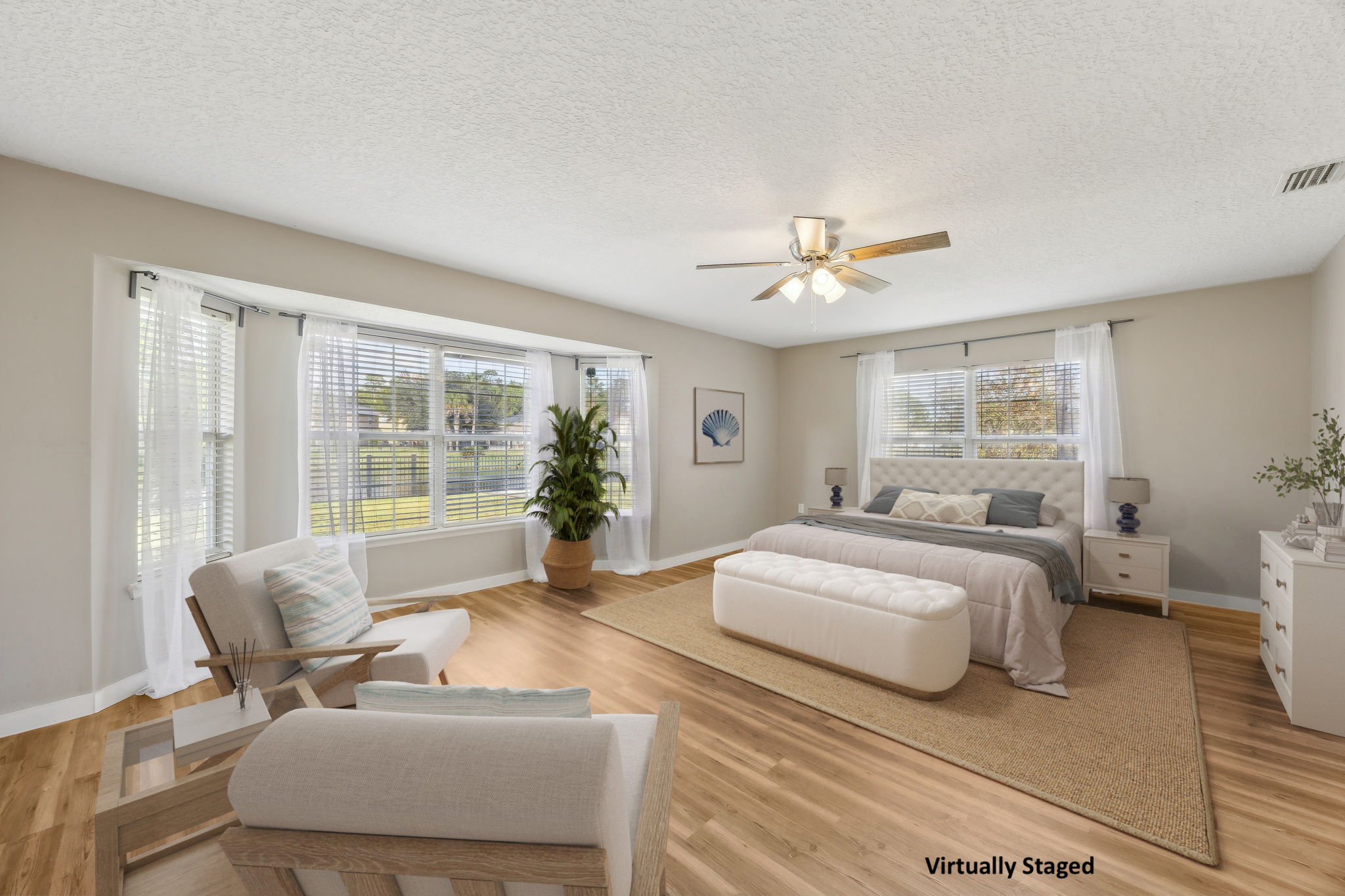 ... as does the master bedroom through a wall of windows that stretch across the room