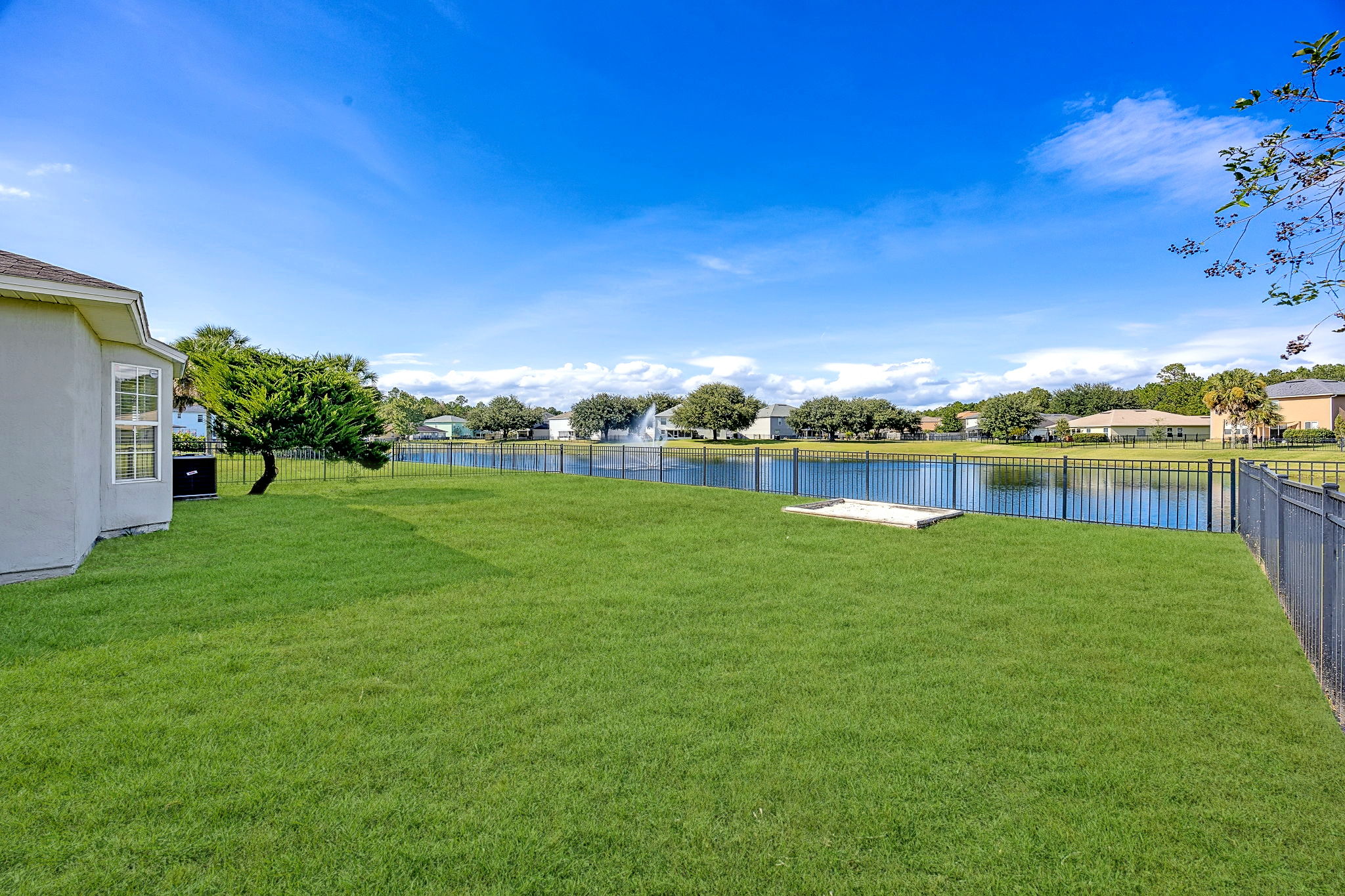 ... while the fenced yard is quite spacious