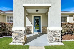 Enter through a welcoming covered porch ...