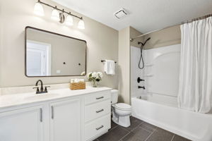 ... and close by, the updated guest bath features contemporary fixtures and a shower/tub combo