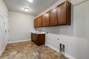 Generous Mudroom off Garage - Custom Cabinets with Sink and Washer & Dryer Hook-Ups