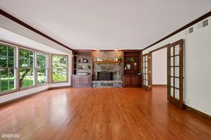 FAMILY ROOM W/WALL OF WINDOWS