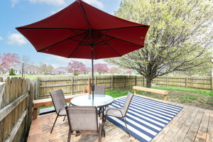 Fenced yard is great for kids and pets.  And this deck is ready for your new paint or stain.