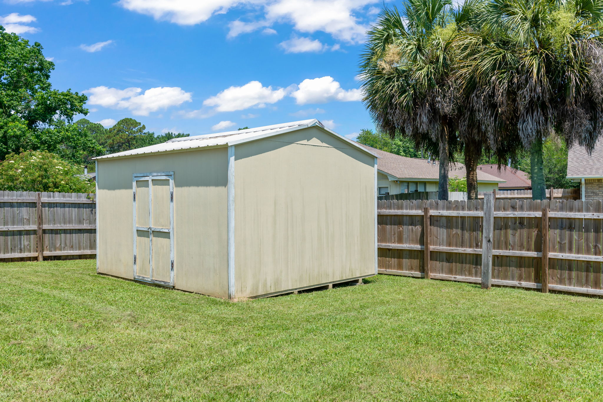 Fenced Back Yard and Storage Building