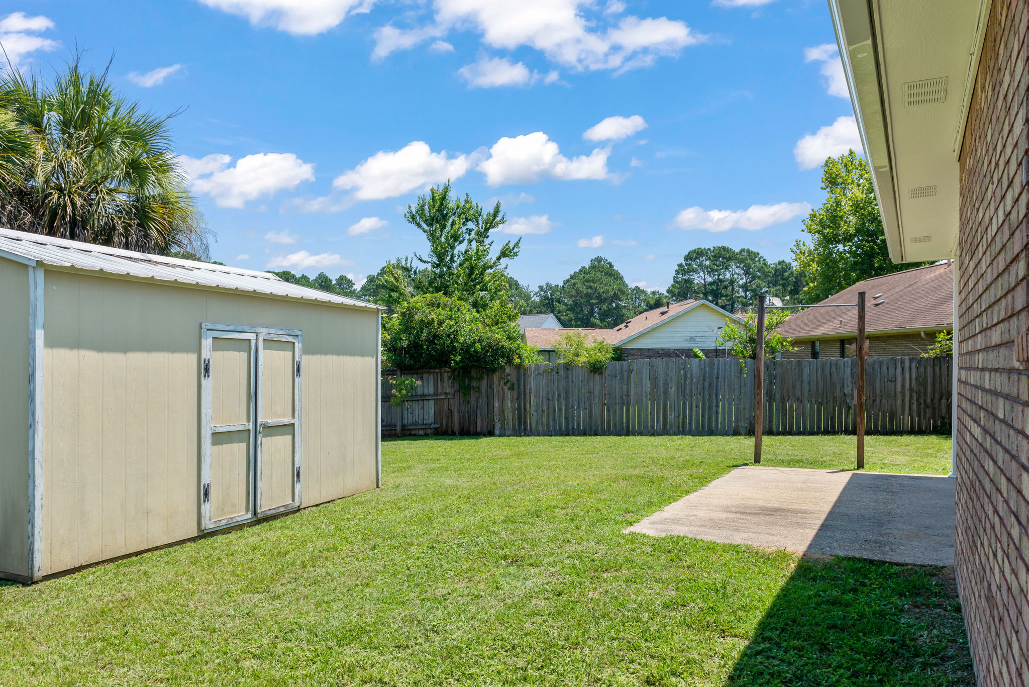 Backyard Showing Storage Building