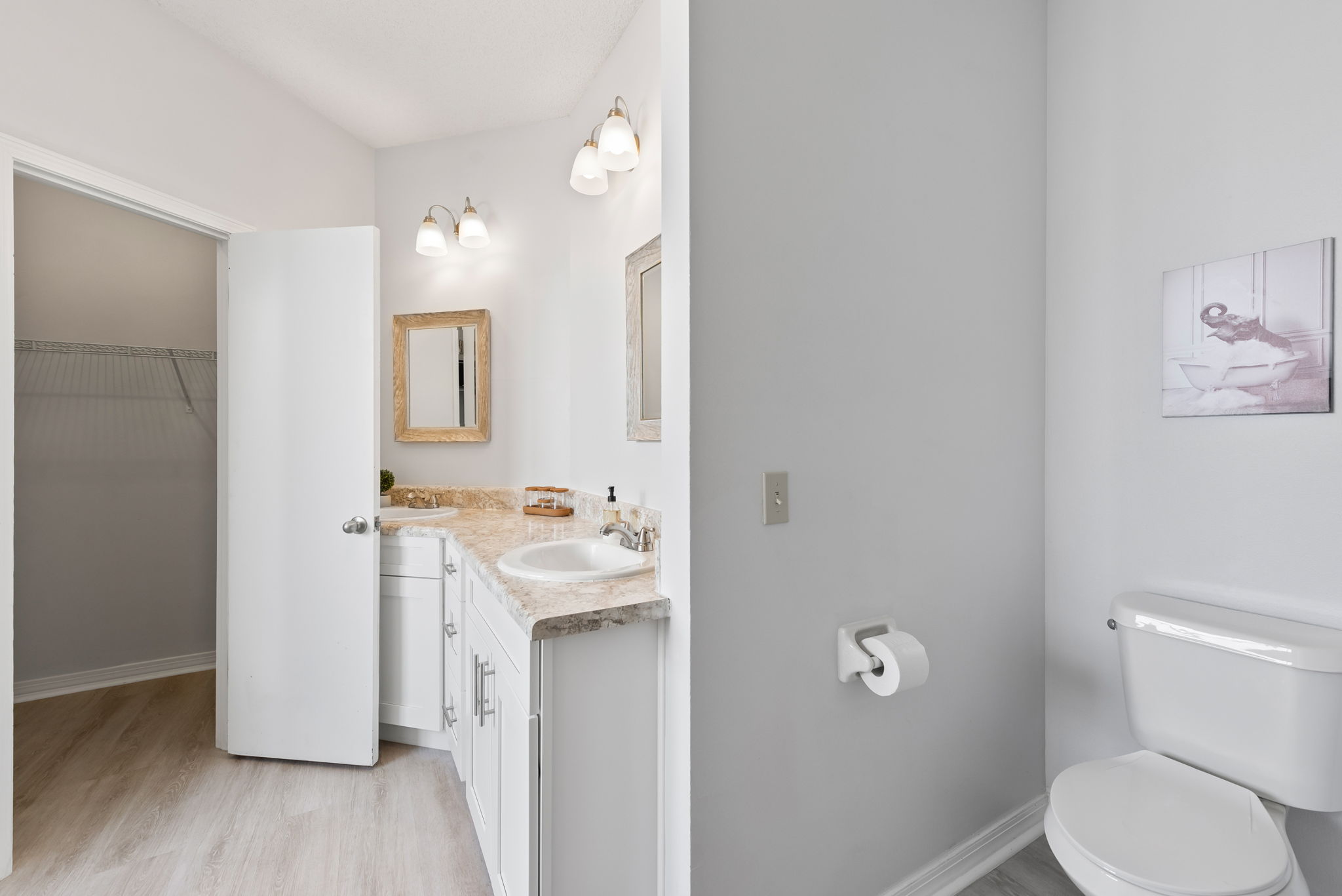 Primary Bathroom Showing Walk In Closet