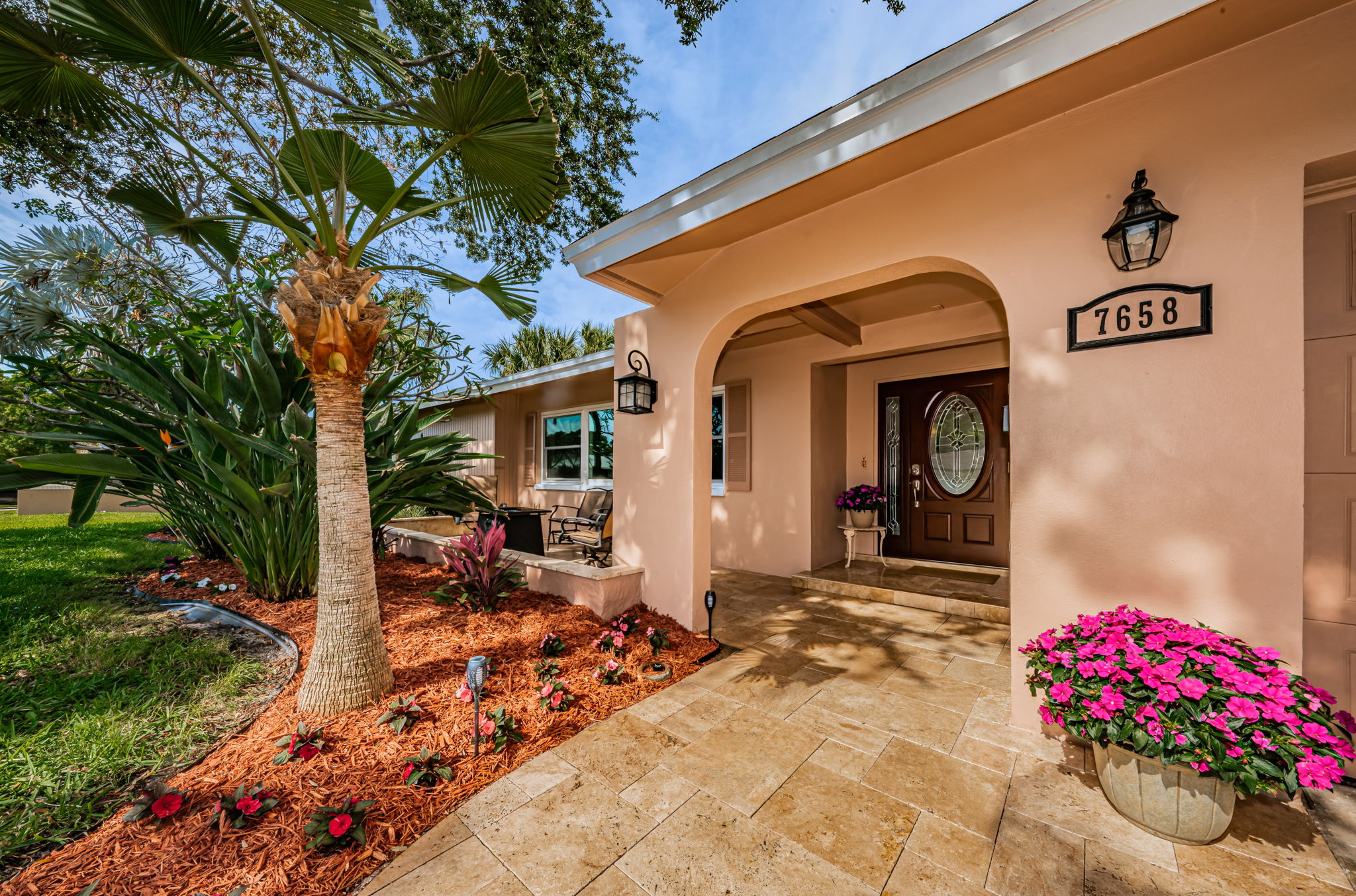 Travertine paved front patio and entrance.