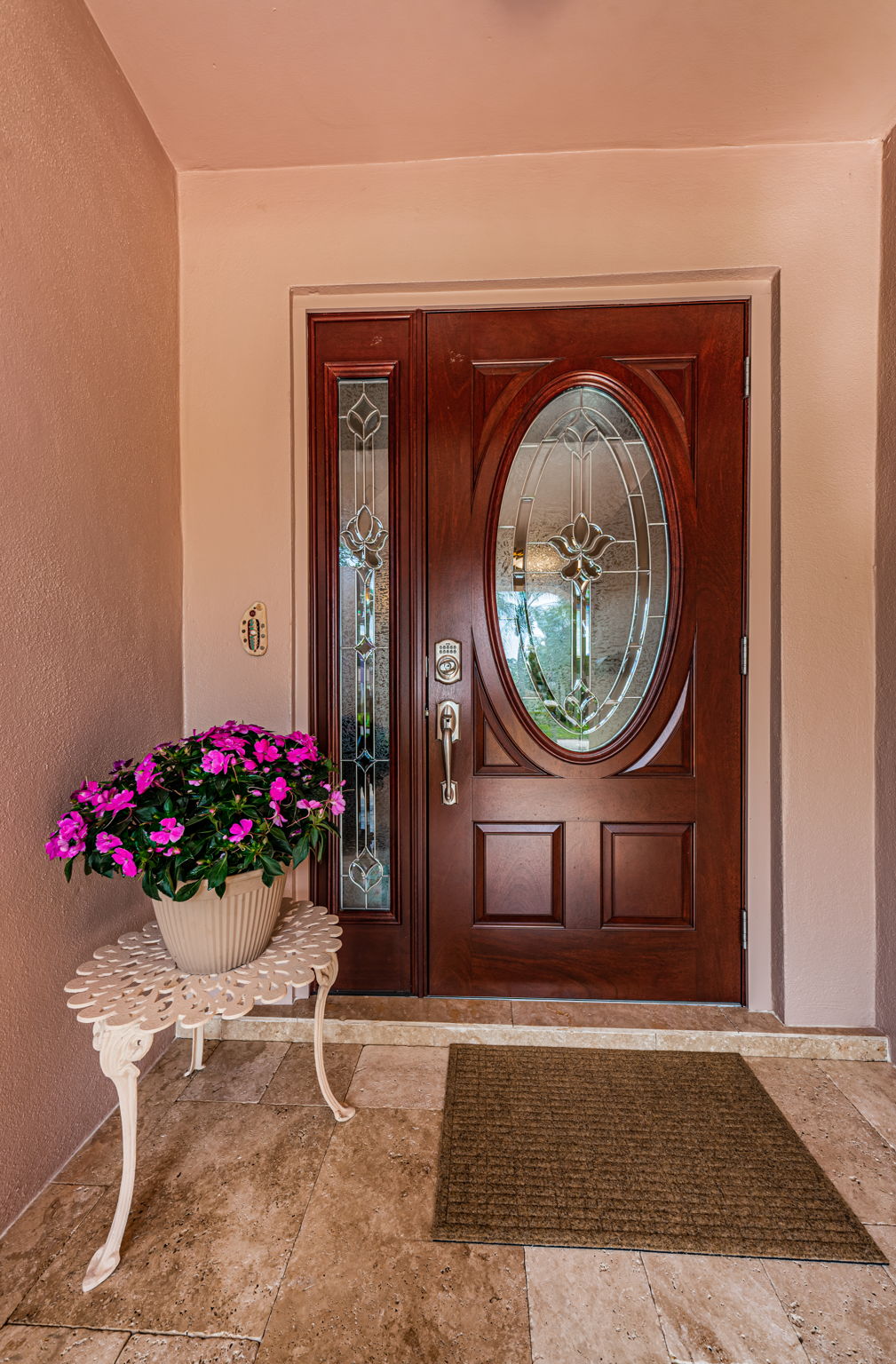 Travertine paved front entry. Front door 10/2022.