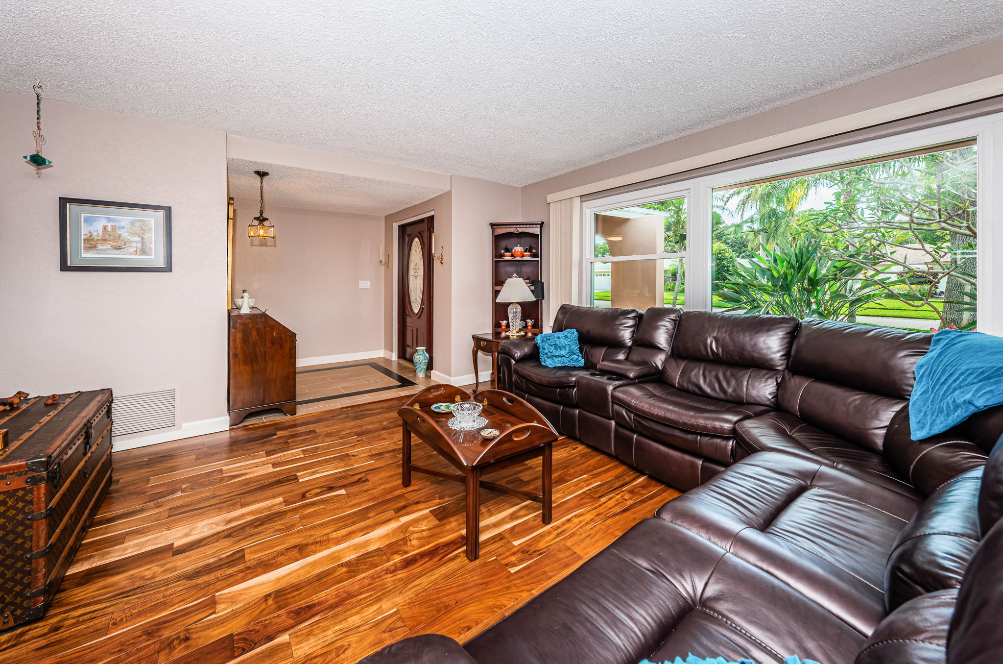 Living Room - beautiful Acacia Wood Flooring. Impact window.