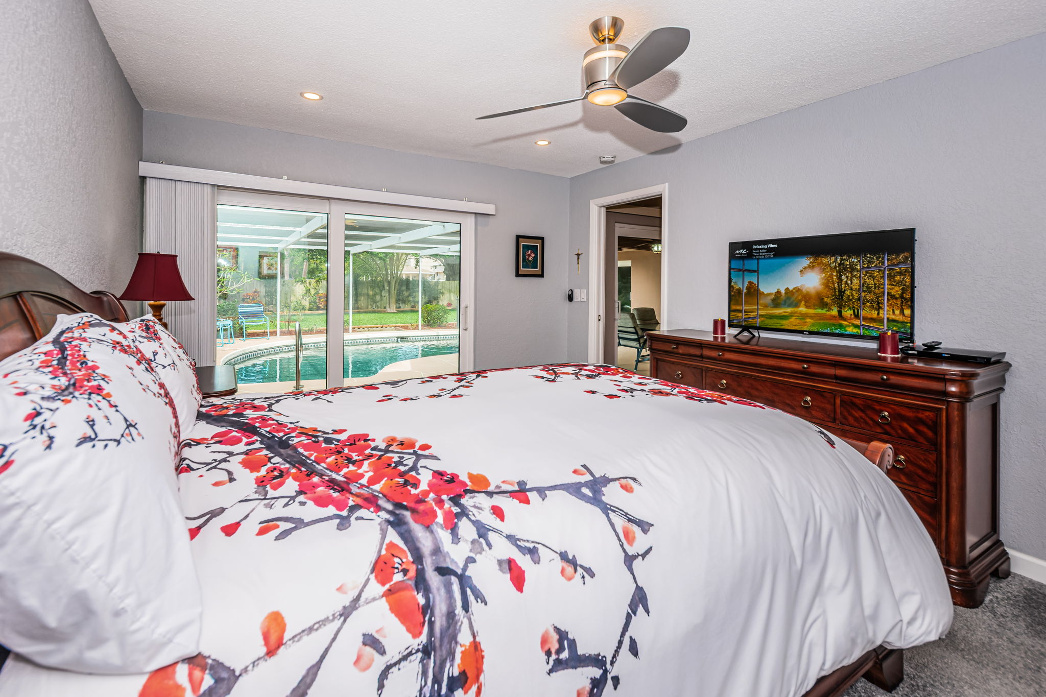 Master Bedroom - Impact Sliders leading to the pool area.