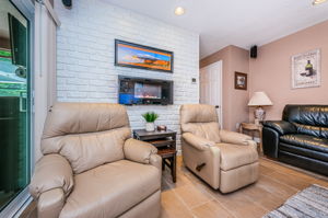 Family Room - Electric Fireplace conveys.